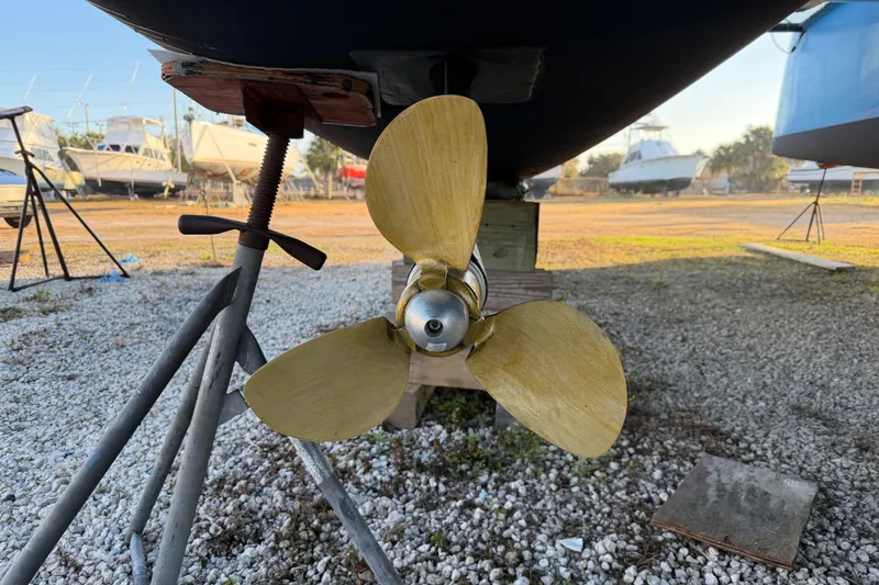 Aurora Yacht Photos Pics Propeller of 2025 C-Catamarans 48 on dry dock, surrounded by other boats.