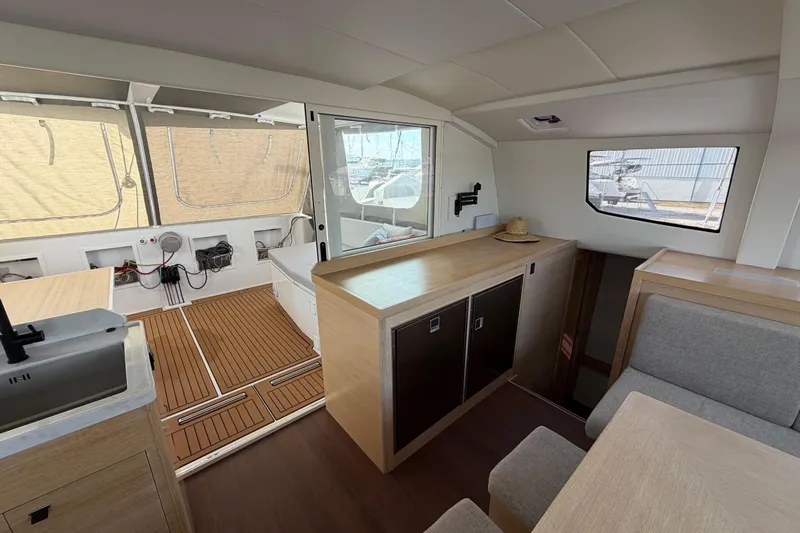 Aurora Yacht Photos Pics Modern interior of 2025 C-Catamarans 48, featuring sleek wood finishes and spacious layout.