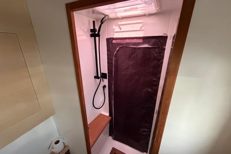 Aurora Yacht Photos Pics Modern shower area in 2025 C-Catamarans 48 yacht, featuring sleek design and wood accents.