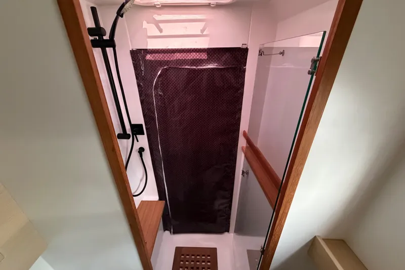Aurora Yacht Photos Pics Modern shower area in 2025 C-Catamarans 48, featuring sleek design and wooden accents.