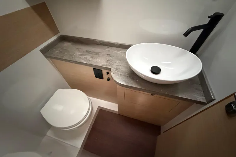 Aurora Yacht Photos Pics Modern bathroom in 2025 C-Catamarans 48, featuring sleek sink and toilet design.
