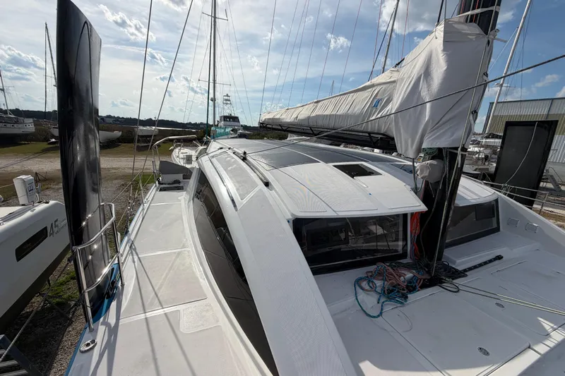 Aurora Yacht Photos Pics 2025 C-Catamarans 48 sailboat on deck, showcasing sleek design and modern rigging.