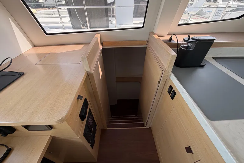 Aurora Yacht Photos Pics Modern interior of 2025 C-Catamarans 48, featuring sleek wood finish and compact design.