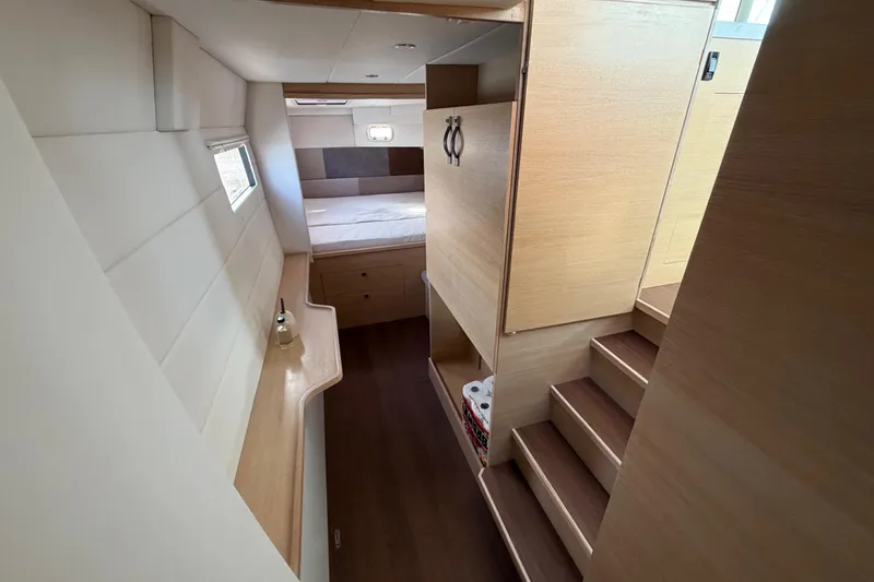 Aurora Yacht Photos Pics Interior of 2025 C-Catamarans 48, featuring modern wood finishes and cozy sleeping area.