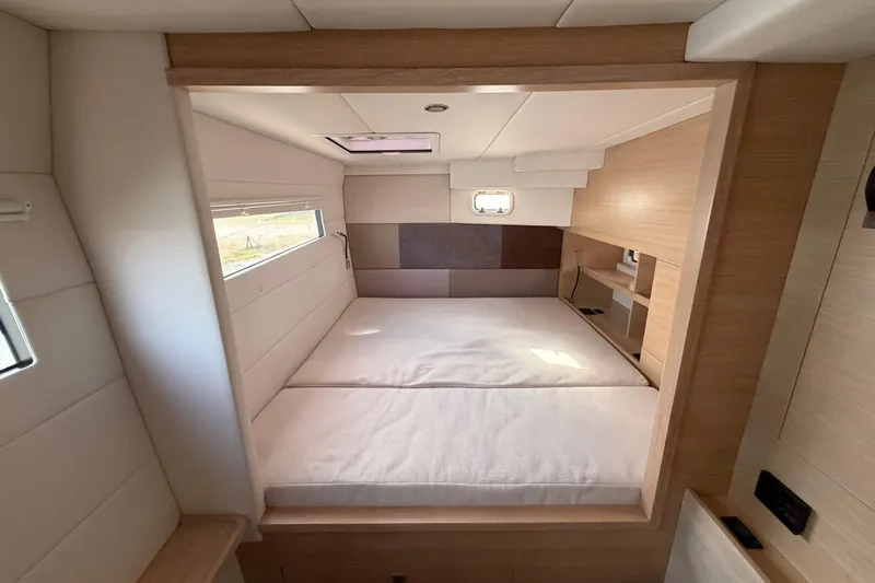 Aurora Yacht Photos Pics Luxurious bedroom interior of 2025 C-Catamarans 48, featuring modern design and ample natural light.