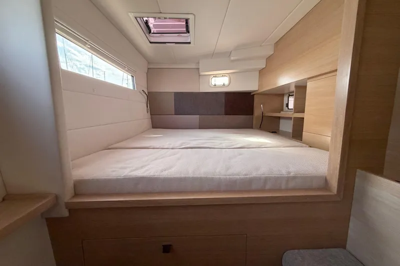 Aurora Yacht Photos Pics Luxurious cabin interior of 2025 C-Catamarans 48 with modern design and comfortable bedding.