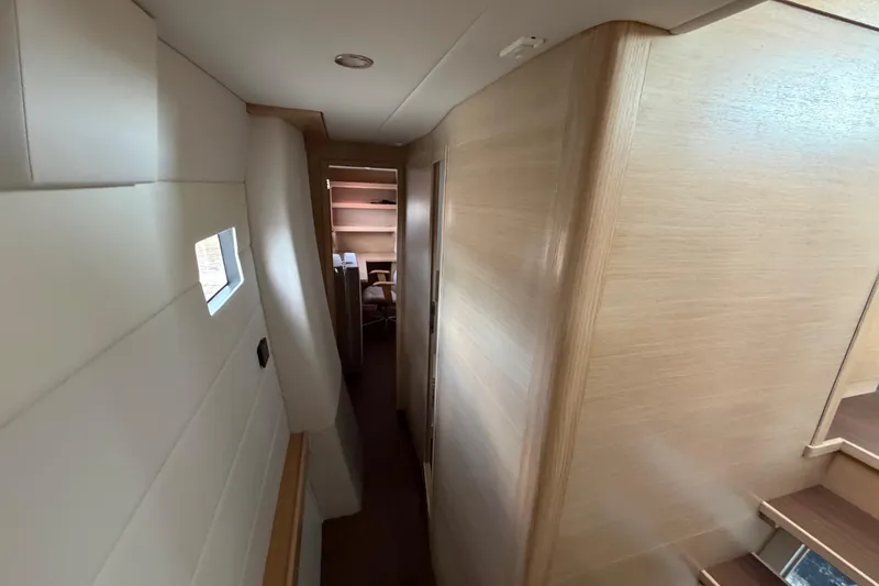 Aurora Yacht Photos Pics Interior hallway of 2025 C-Catamarans 48, featuring modern wood paneling and compact design.