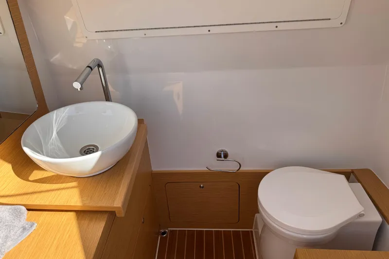  Yacht Photos Pics Modern bathroom in 2025 Skipper-BSK 38NC yacht with sink and toilet.