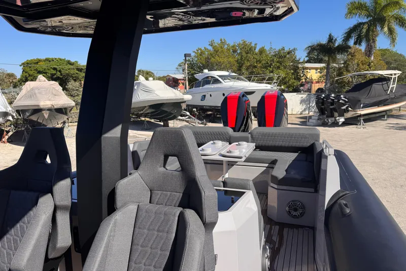  Yacht Photos Pics 2025 Skipper-BSK 38NC boat interior with modern seating and outdoor setting.