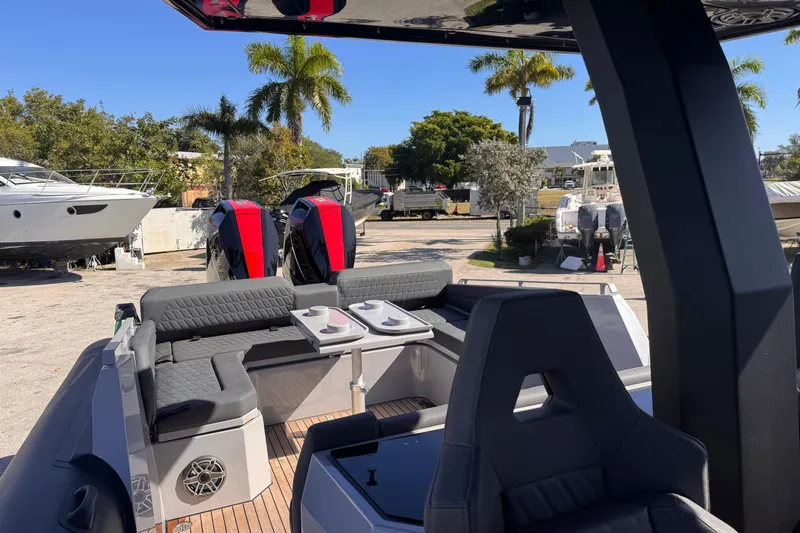  Yacht Photos Pics 2025 Skipper-BSK 38NC boat interior with seating, table, and dual engines.