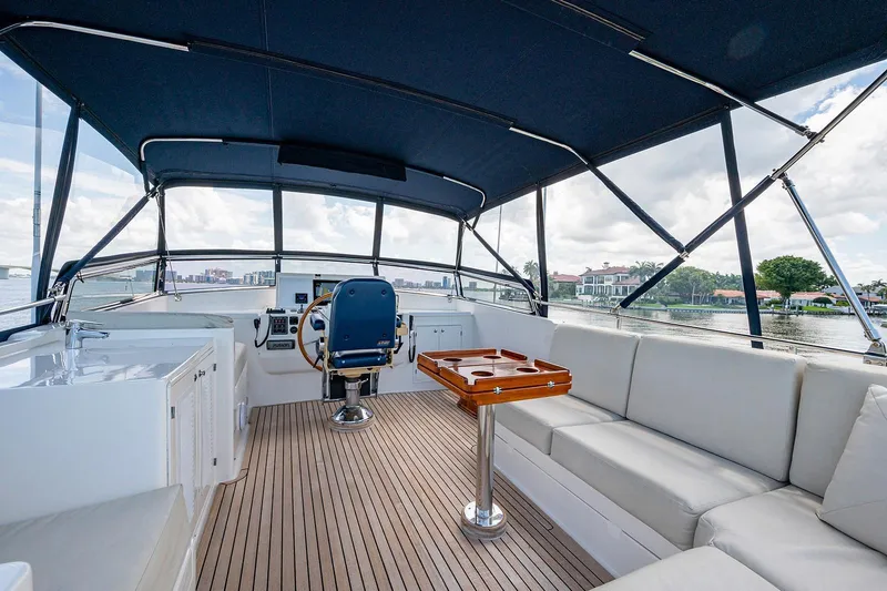 First Light Yacht Photos Pics Luxurious 2007 Grand Banks 47 Classic yacht interior with seating and helm.