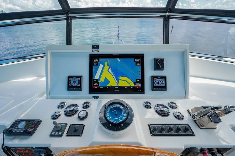 First Light Yacht Photos Pics Helm of 2007 Grand Banks 47 Classic yacht with navigation instruments and sea view.