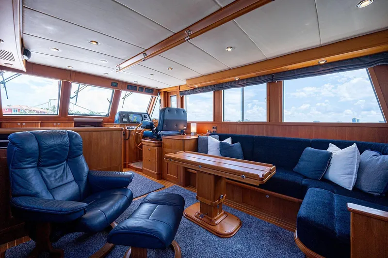 First Light Yacht Photos Pics Luxurious interior of 2007 Grand Banks 47 Classic yacht with plush seating and wooden accents.