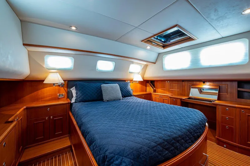 First Light Yacht Photos Pics Luxurious cabin interior of 2007 Grand Banks 47 Classic yacht with elegant wood finish.