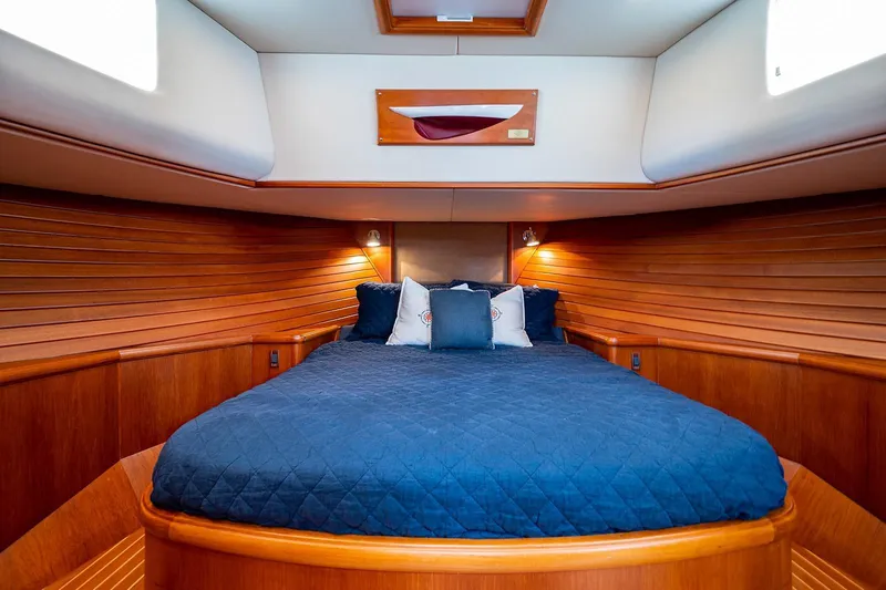 First Light Yacht Photos Pics Luxurious cabin interior of 2007 Grand Banks 47 Classic yacht with cozy bedding.