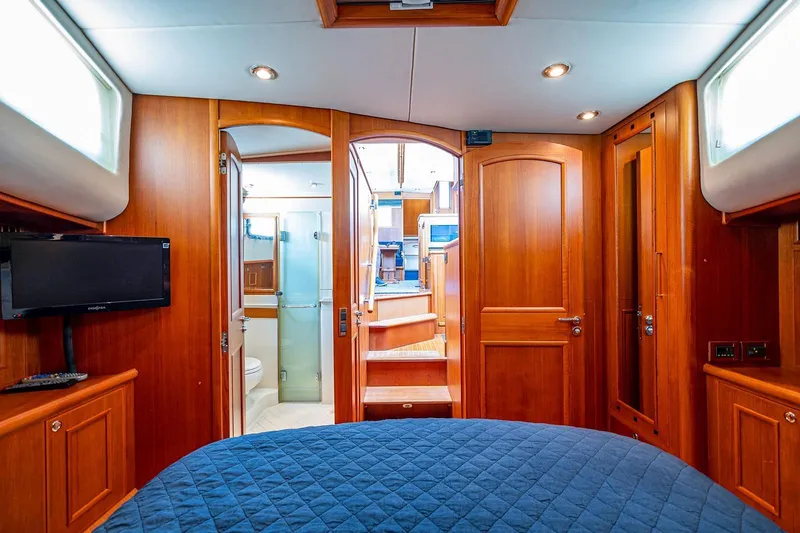 First Light Yacht Photos Pics Luxurious 2007 Grand Banks 47 Classic yacht interior with wood finish and modern amenities.