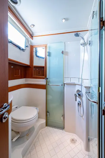 First Light Yacht Photos Pics Bathroom interior of 2007 Grand Banks 47 Classic yacht, featuring shower and toilet.