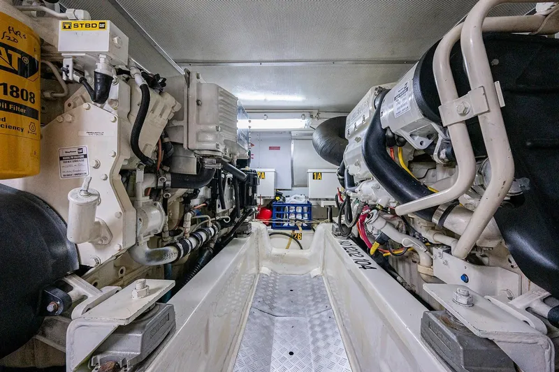 First Light Yacht Photos Pics Engine room of 2007 Grand Banks 47 Classic yacht, showcasing mechanical components and systems.