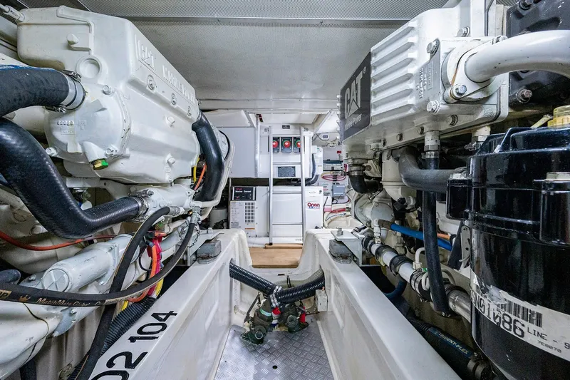 First Light Yacht Photos Pics Engine room of 2007 Grand Banks 47 Classic yacht, showcasing dual engines and mechanical systems.