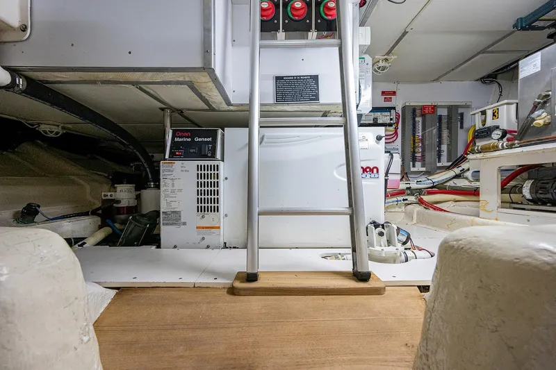 First Light Yacht Photos Pics Engine room of 2007 Grand Banks 47 Classic yacht with equipment and ladder.