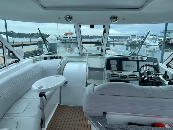 Bella Blue Yacht Photos Pics Interior of 2010 Formula 45 yacht with modern helm and seating at marina.