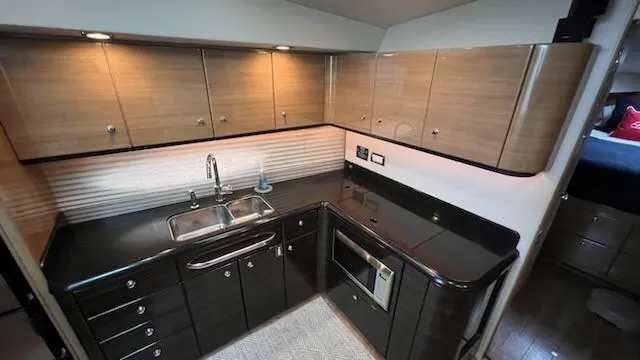 Bella Blue Yacht Photos Pics Modern kitchen in 2010 Formula 45 yacht with sleek cabinetry and appliances.