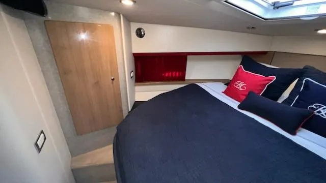 Bella Blue Yacht Photos Pics Luxurious cabin interior of 2010 Formula 45 yacht with elegant bedding and modern design.