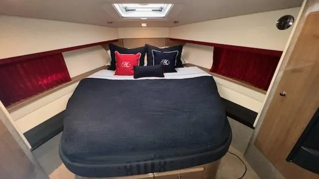 Bella Blue Yacht Photos Pics Luxurious cabin interior of 2010 Formula 45 yacht with plush bedding and elegant decor.