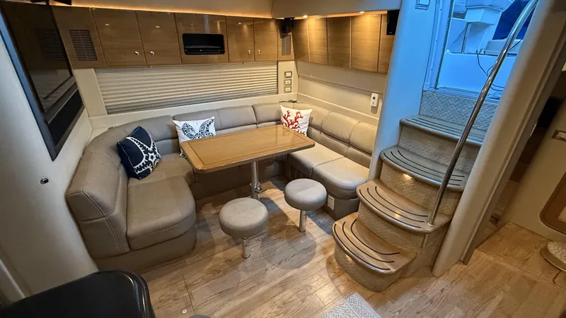 Bella Blue Yacht Photos Pics Luxurious interior of 2010 Formula 45 yacht with cozy seating and elegant wooden finishes.