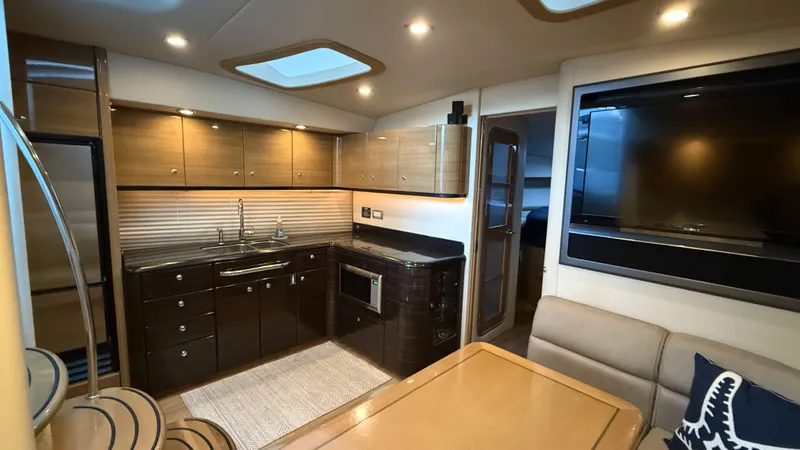 Bella Blue Yacht Photos Pics Luxurious 2010 Formula 45 yacht interior with modern kitchen and dining area.