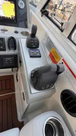 Bella Blue Yacht Photos Pics Control panel of a 2010 Formula 45 boat with joystick and throttle.