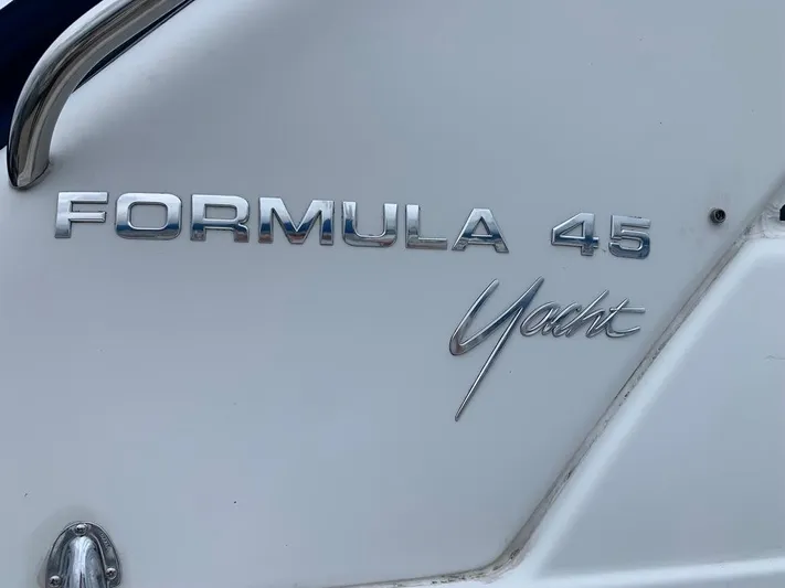 Bella Blue Yacht Photos Pics Close-up of 2010 Formula 45 Yacht logo on white surface.