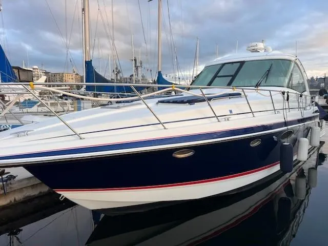 Bella Blue Yacht Photos Pics 2010 Formula 45 yacht docked in marina, sleek design, blue and white exterior.