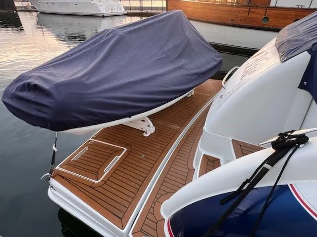 Bella Blue Yacht Photos Pics 2010 Formula 45 yacht with covered equipment on teak deck at marina.