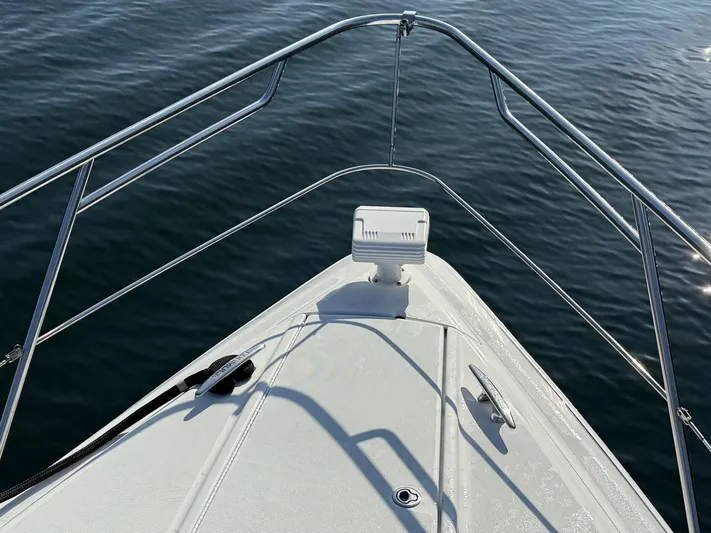 Bella Blue Yacht Photos Pics Bow of 2010 Formula 45 boat on calm water.