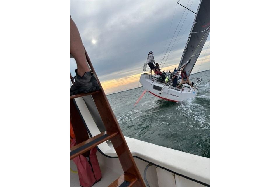 Sailing Dehler 30 OD yacht on open water, 2020 model, with crew in action.