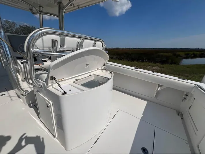  Yacht Photos Pics 2013 Jupiter 30 FS boat interior with open storage compartment, sleek design, and sunny weather.