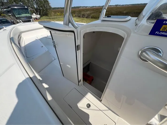  Yacht Photos Pics 2013 Jupiter 30 FS boat interior with open storage compartment, showcasing sleek design and functionality.