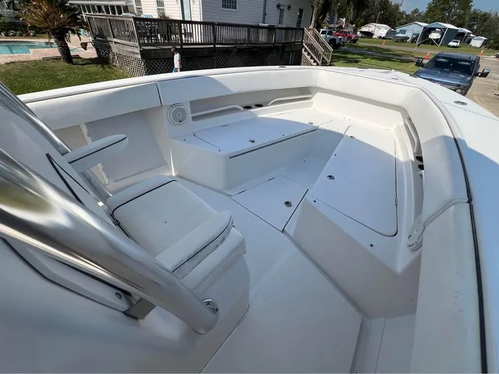  Yacht Photos Pics 2013 Jupiter 30 FS boat interior with white seating and storage compartments.