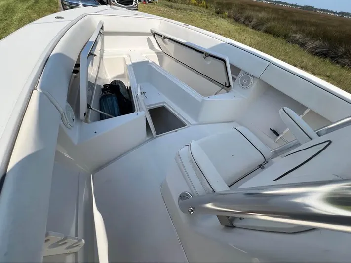  Yacht Photos Pics 2013 Jupiter 30 FS boat interior with white seating and storage compartments.