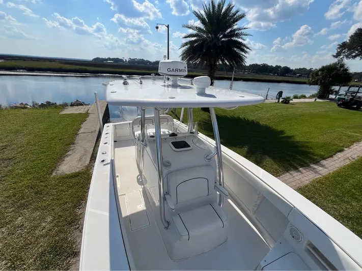  Yacht Photos Pics 2013 Jupiter 30 FS boat docked by a scenic waterfront with clear skies.