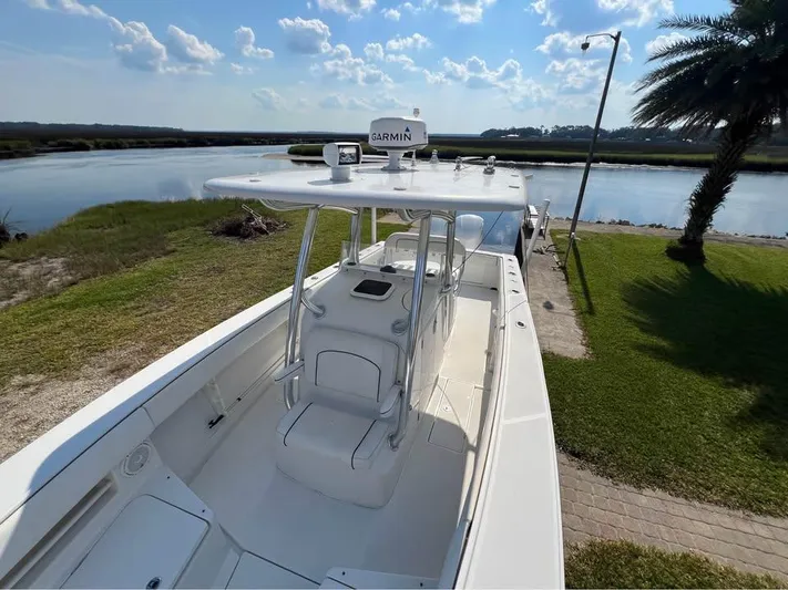  Yacht Photos Pics 2013 Jupiter 30 FS boat docked by a scenic waterfront with clear skies.
