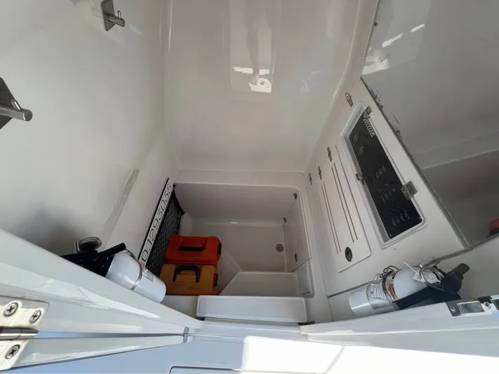  Yacht Photos Pics 2013 Jupiter 30 FS boat interior with storage and safety equipment.