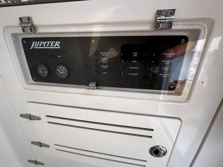  Yacht Photos Pics Control panel of a 2013 Jupiter 30 FS boat with gauges and switches.