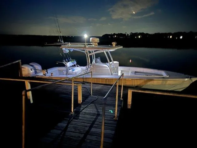  Yacht Photos Pics 2013 Jupiter 30 FS boat docked at night, illuminated by soft lighting.