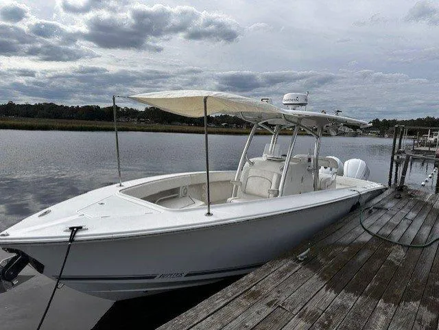  Yacht Photos Pics 2013 Jupiter 30 FS boat docked by a wooden pier under cloudy skies.