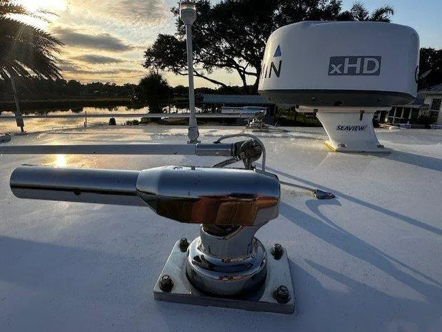  Yacht Photos Pics Close-up of a 2013 Jupiter 30 FS boat's radar and equipment at sunset.