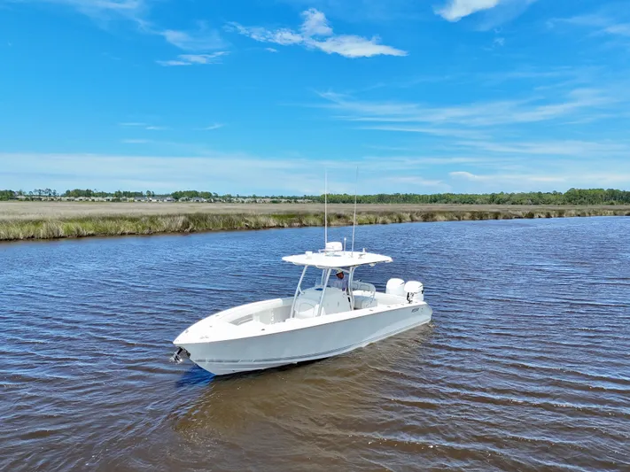  Yacht Photos Pics 2013 Jupiter 30 FS boat on calm water under clear blue sky.
