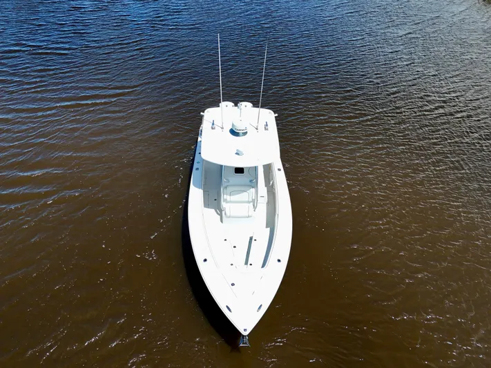  Yacht Photos Pics Aerial view of 2013 Jupiter 30 FS boat on calm water.