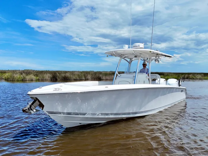  Yacht Photos Pics 2013 Jupiter 30 FS boat on calm water under a blue sky.